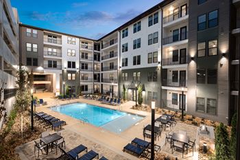 Resort style pool with sun deck & grill area